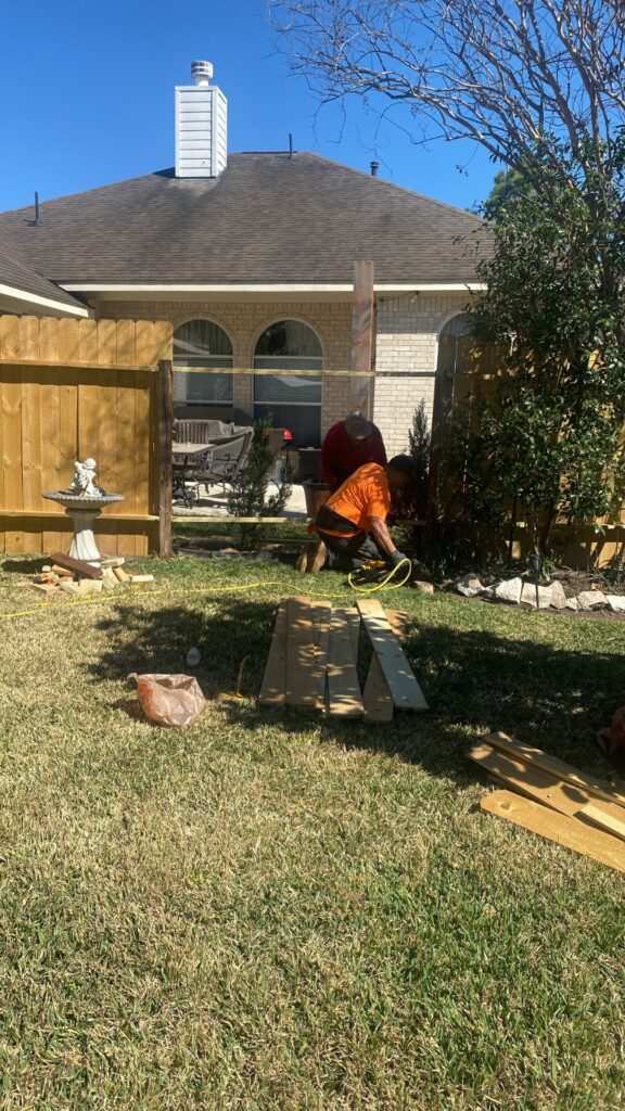 Fence construction detail beside a yard